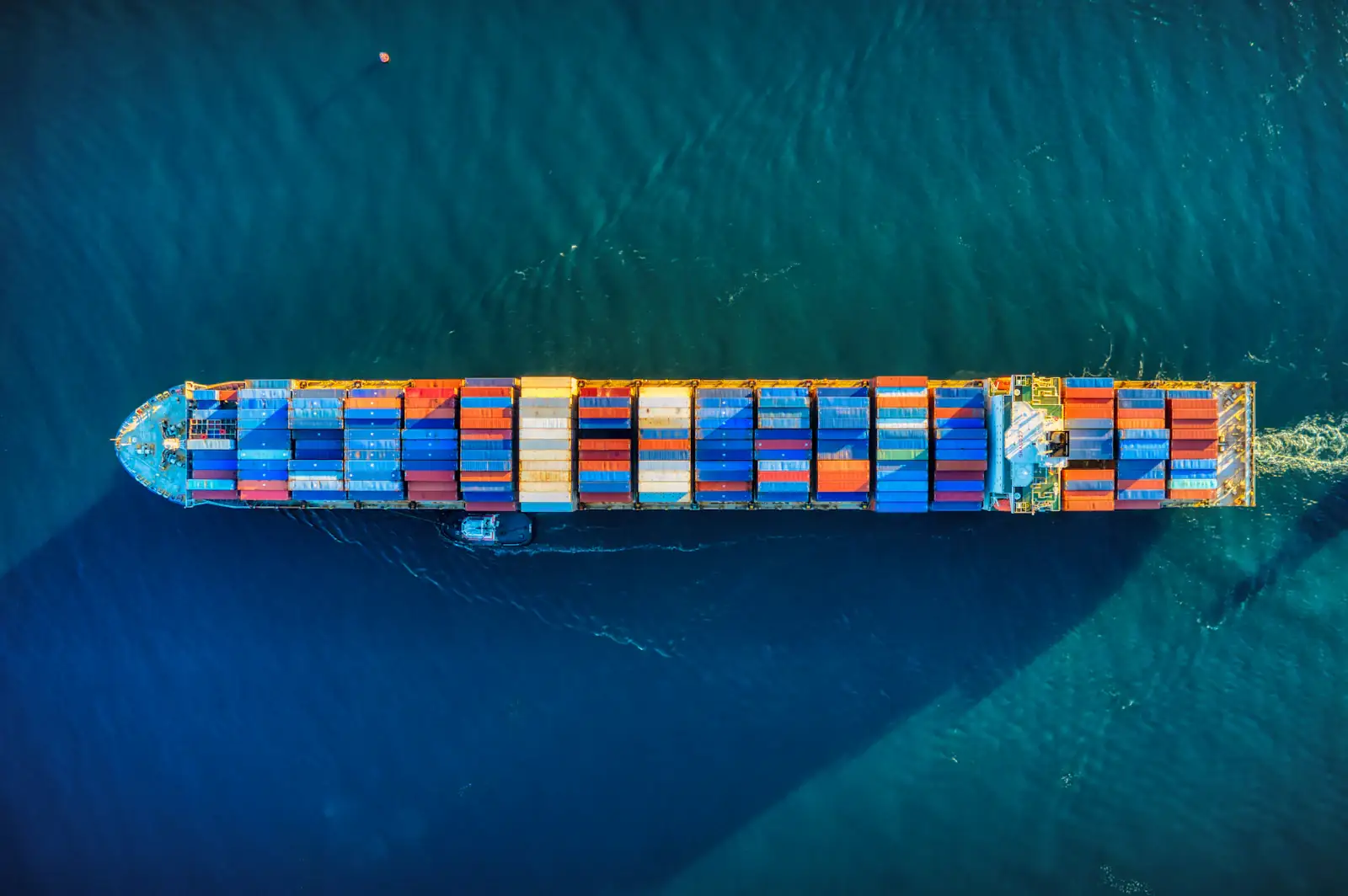 A container ship seen from above on open water.